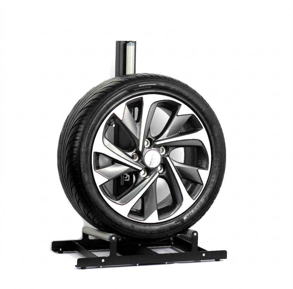 Car tire on a stand with a white background